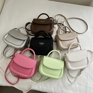 Chic textured crossbody handbags for women in seven colors on white fabric background