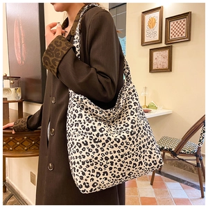 Close-up of leopard print canvas tote bag with thick fabric texture and spacious design