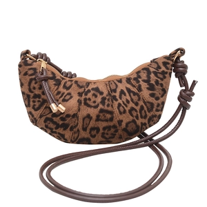 Fashionable leopard print crescent bag with plush texture and adjustable shoulder strap