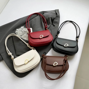 Vintage minimalist saddle bags in four colors with modern gold buckle and knotted straps