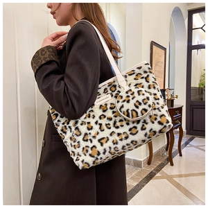 Detail of leopard print plush tote bag with a small matching round coin purse