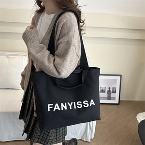 Black canvas tote bag with FANYISSA letter print, large capacity casual shoulder bag for women
