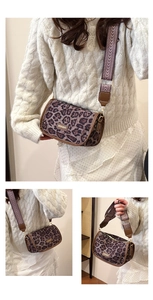 Detail view of leopard print crossbody bag featuring a wide woven strap and metal logo