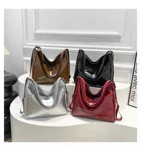 Multiple colors of high-capacity PU leather tote bags in brown, black, silver, and red