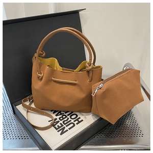 Brown faux suede bucket bag set with knot handle and yellow lining on black gift box