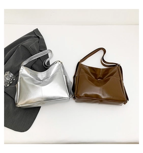 Detail of glossy silver and brown versatile backpacks with adjustable shoulder straps