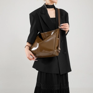 Brown minimalist high-gloss leather hobo bag with wide adjustable shoulder strap