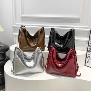 Fashionable glossy leather tote bag for women in dark brown, black, silver, and burgundy colors