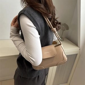 French vintage solid color shoulder bag in matte khaki leather with knot strap detail