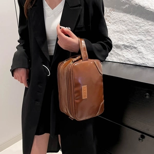 Brown faux leather large capacity cosmetic bag with dual zipper and top handle