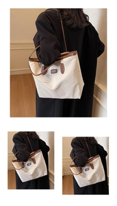 Detailed view of the off-white nylon tote bag with brown leather straps and metal logo