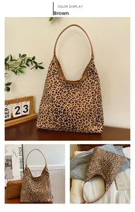 Detailed close-up of large leopard print canvas tote bag in brown for daily commute