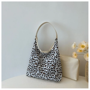 Detailed shot of leopard print tote bag set with matching beige small coin purse