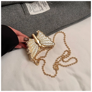 Exquisite gold butterfly clutch bag with shimmering crystals and metallic chain strap