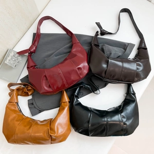 Croissant cloud shoulder bag with pleated details and knotted strap in four retro colors