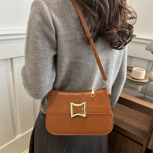 Brown quilted crossbody bag for women with golden buckle and adjustable strap