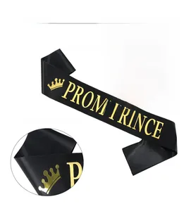 Detail of black Prom Prince sash with gold foil lettering and crown on satin fabric