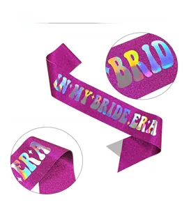 Macro view of purple glitter fabric sash with holographic IN MY BRIDE ERA gold lettering