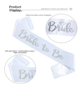 Detail of white satin Bride to Be sash with silver glitter lettering and diamond icon