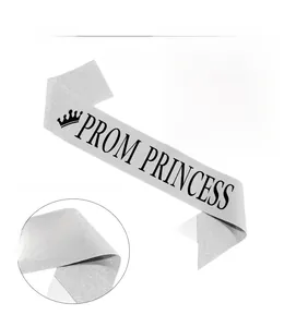 Detail of silver glitter sash with black Prom Princess lettering and crown icon