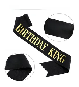 Detail of black glitter Birthday King sash showing the premium gold foil lettering