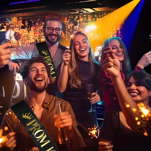 Detail of black satin Prom King sash with gold foil crown and text for party celebrations