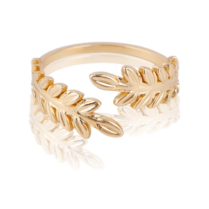 Detailed view of polished golden leaf-shaped ring with adjustable open band design