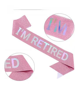 Pink glitter sash with I'M RETIRED laser lettering for retirement party decoration