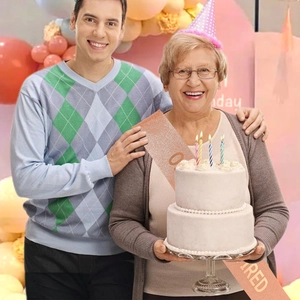 Close-up of rose gold glitter sash for retirement parties with decorative cake and balloons
