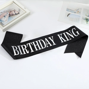Sparkling black Birthday King sash with bold white lettering for men's party decorations