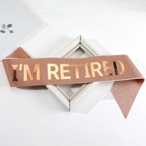 Rose gold glitter I'M RETIRED sash with metallic gold lettering for retirement party decor