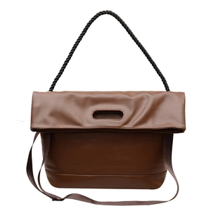 Retro deep brown leather tote bag with unique black twisted handle and long strap