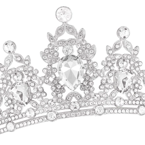 Detailed close-up of intricate silver crown featuring pear-cut and round crystals