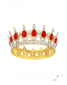 Detail of golden Baroque tiara with sparkling red teardrop stones and white crystals