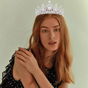 Elegant silver bridal crown with crystals and drop-shaped rhinestones for wedding parties