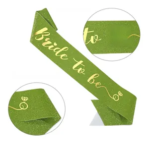 Detail of green glitter Bride to be sash with gold foil text and ring icon for bridal party