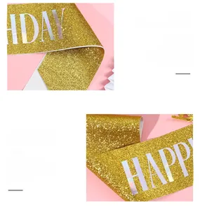 Detail of shimmering gold glitter sash with bold Happy Birthday lettering for party