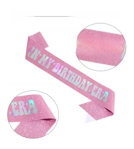 Close-up of pink glitter sash with laser gold IN MY BIRTHDAY ERA retro lettering