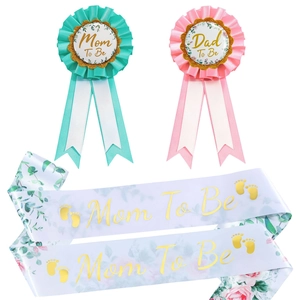 Baby shower set with Mom to Be sash and colorful corsages for gender reveal parties