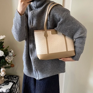 Large woven tote bag in cream and khaki with leather texture for winter fashion