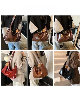 Detailed views of large glossy tote bag with teddy charm in brown, burgundy and black