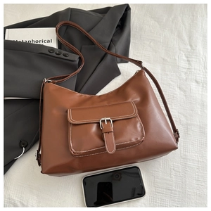 Brown vintage PU leather hobo bag with large capacity and buckle detail on white background