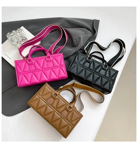 Three geometric quilted handbags in rose, black and brown with removable wide straps
