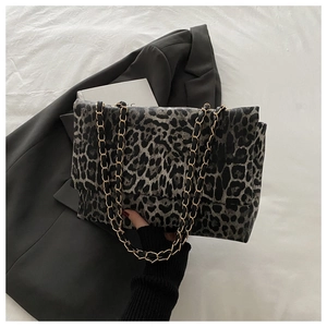 Leopard print crossbody bag with gold chain strap in grey and black textured faux leather