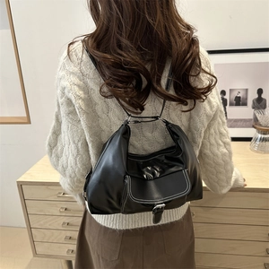 Minimalist black PU leather half-moon shoulder bag with white contrast stitching