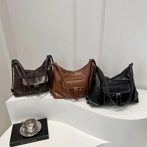Three minimalist large capacity tote bags in coffee, brown, and black with contrast stitching