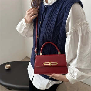 Chic red square handbag with gold metal lock and shoulder strap for elegant women