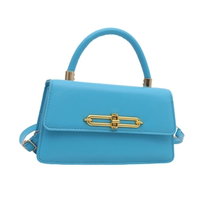 Minimalist bright blue square handbag with gold bar lock and top handle for women
