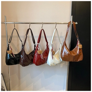 Collection of glossy PU leather crescent bags in five colors with cute bear pendants