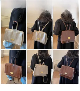 Detailed views of vintage oil wax leather backpack in brown and khaki with top handle